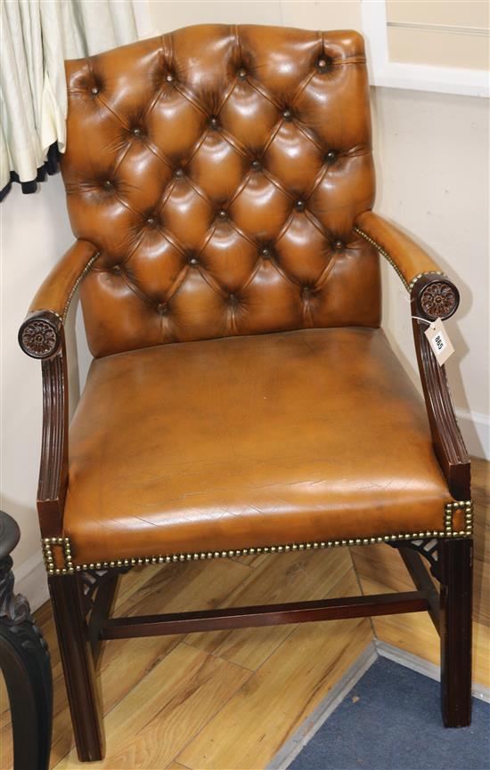 A mahogany framed leather button back Gainsborough armchair